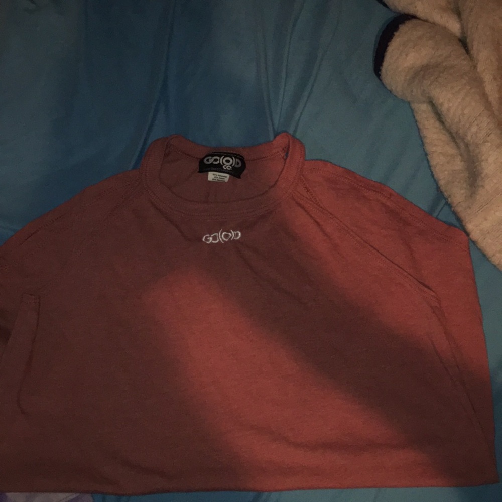 A reddish orange tank top